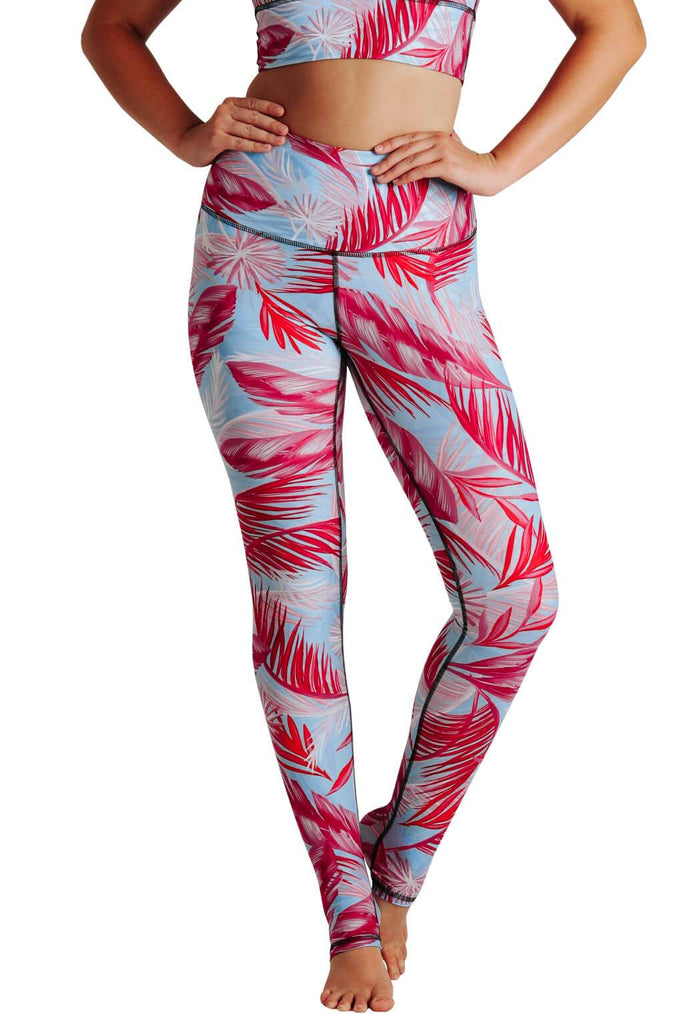 Yoga Democracy Women's Eco-friendly yoga pants leggings in Hot Tropic Flamingo pink and baby blue print. USA made from post-consumer recycled plastic bottles. Sweat wicking, anti-microbial, and quick dry ultra-soft brushed fabric.