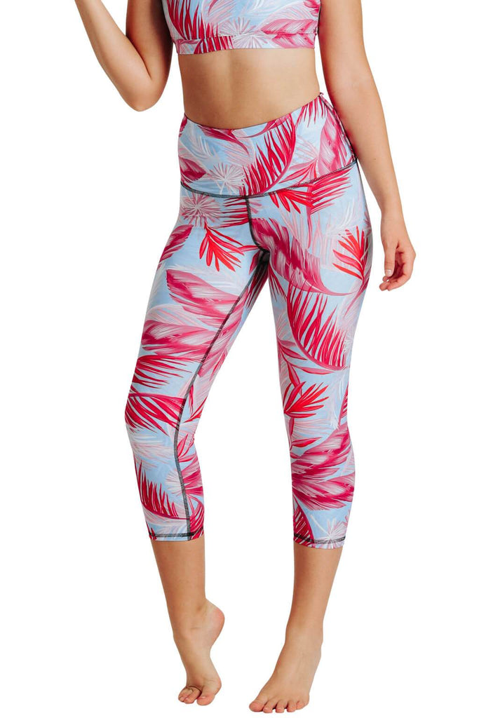 Yoga Democracy Women's Eco-friendly yoga capris crop leggings in Hot Tropic flamingo pink and blue print. USA made from post-consumer recycled plastic bottles. Sweat wicking, anti-microbial, and quick dry ultra-soft brushed fabric.