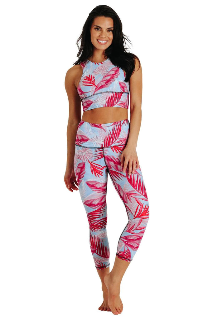 Yoga Democracy Women's Eco-friendly yoga capris crop leggings in Hot Tropic flamingo pink and blue print. USA made from post-consumer recycled plastic bottles. Sweat wicking, anti-microbial, and quick dry ultra-soft brushed fabric.