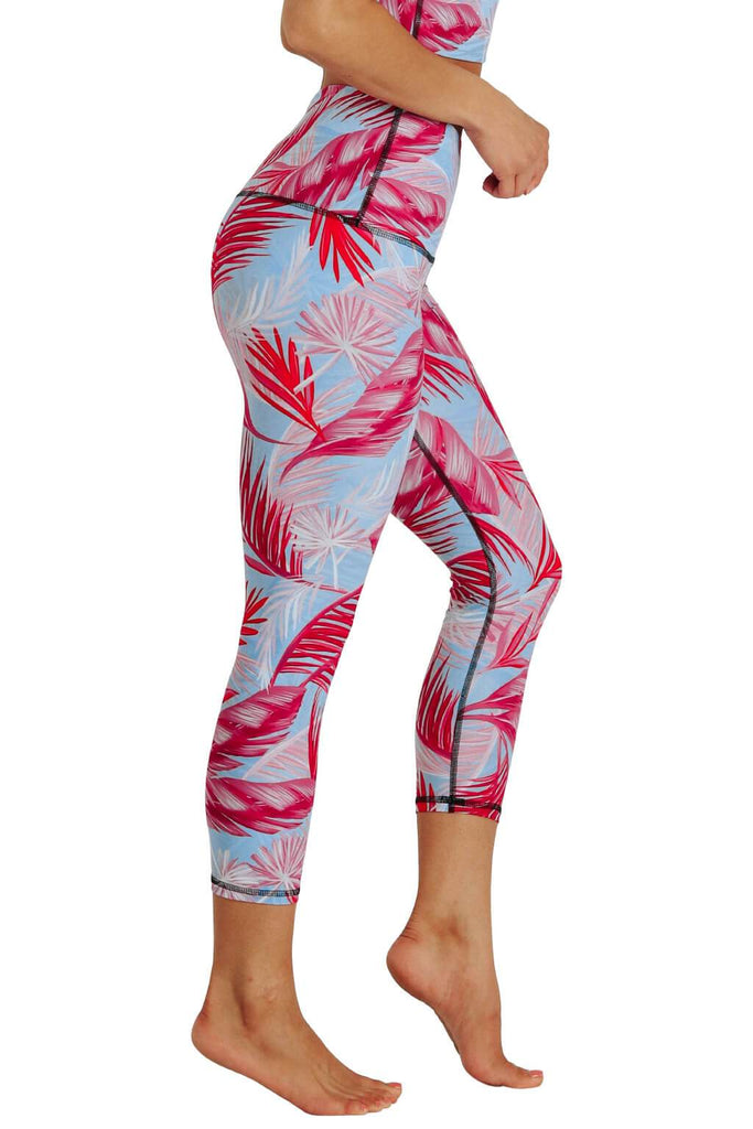 Yoga Democracy Women's Eco-friendly yoga capris crop leggings in Hot Tropic flamingo pink and blue print. USA made from post-consumer recycled plastic bottles. Sweat wicking, anti-microbial, and quick dry ultra-soft brushed fabric.