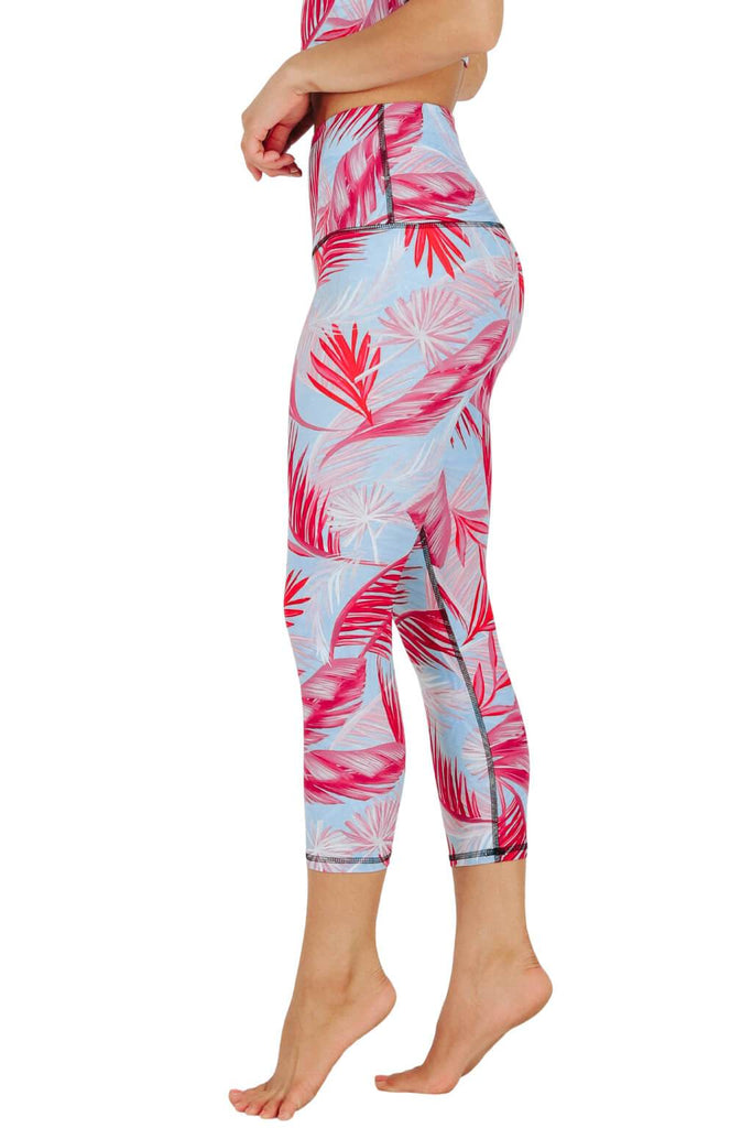 Yoga Democracy Women's Eco-friendly yoga capris crop leggings in Hot Tropic flamingo pink and blue print. USA made from post-consumer recycled plastic bottles. Sweat wicking, anti-microbial, and quick dry ultra-soft brushed fabric.